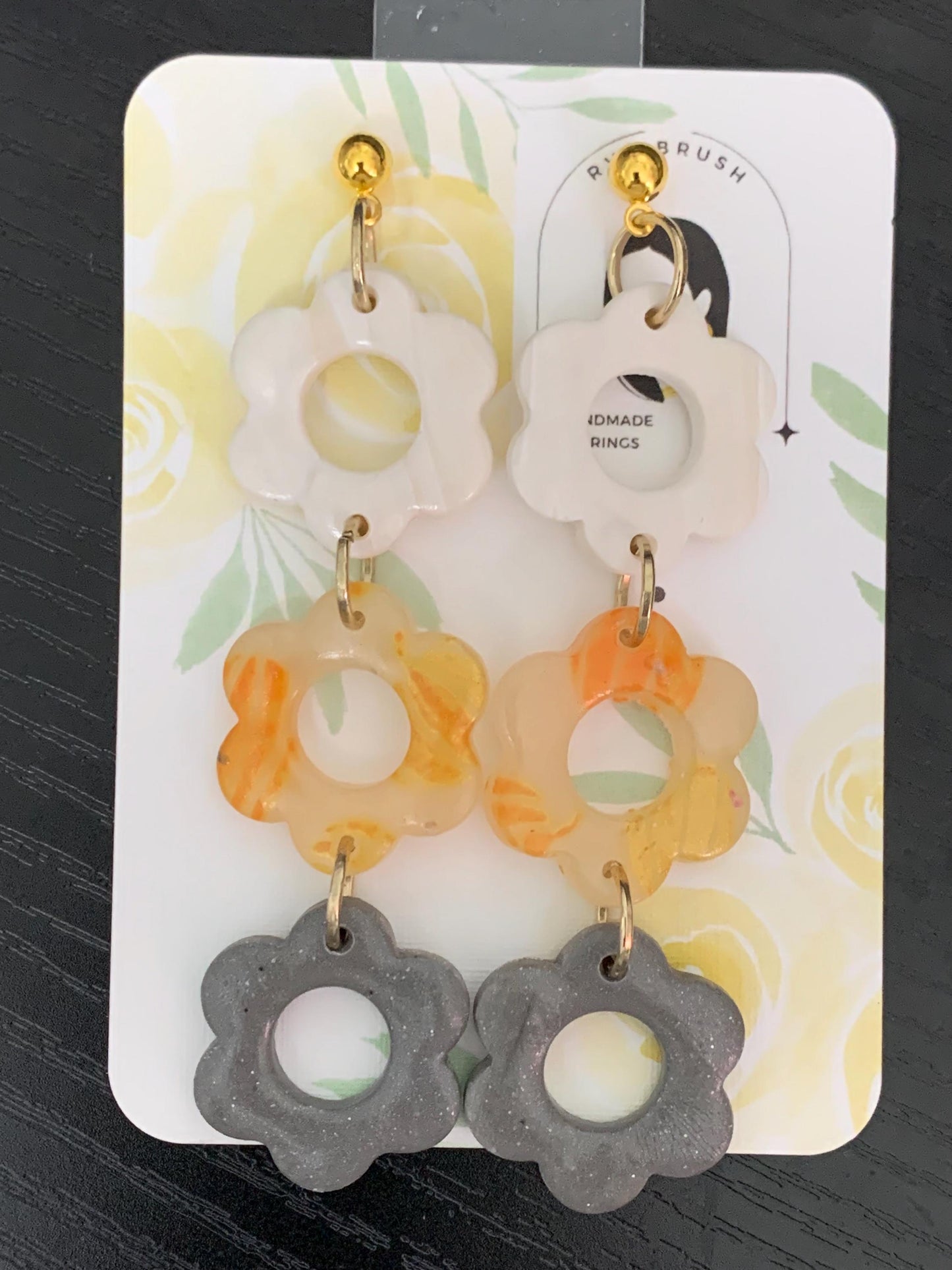 Triple flower dangle earrings stacked daisy shapes in white orange and gray polymer clay playful lightweight statement Gift for her
