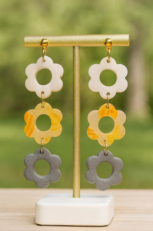 Triple flower dangle earrings stacked daisy shapes in white orange and gray polymer clay playful lightweight statement Gift for her
